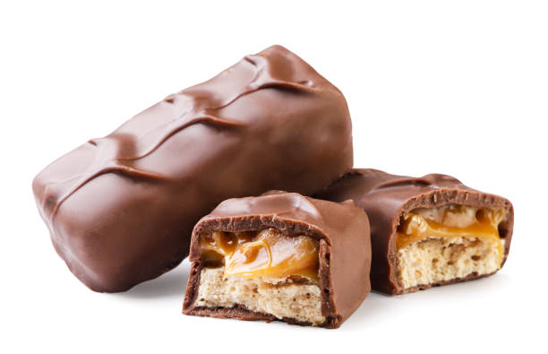 istock Chocolate bar with nuts and caramel close-up on a white. Isolated 2047854819