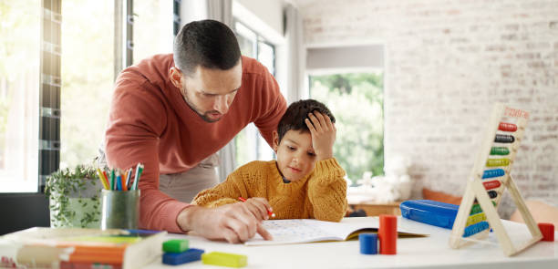 istock Home learning, father or kid in kindergarten studying for knowledge, education or growth development. Abacus, dad teaching or child writing, working or counting on numbers for math test in notebook 2047855367