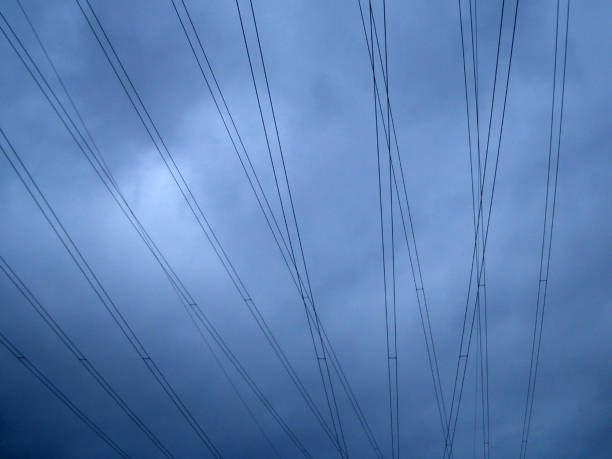 Series of electrical power lines next to a town