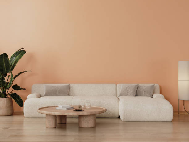 istock modern living room interior with white and peach color wall, big white sofa with table, 3d render 2047876571