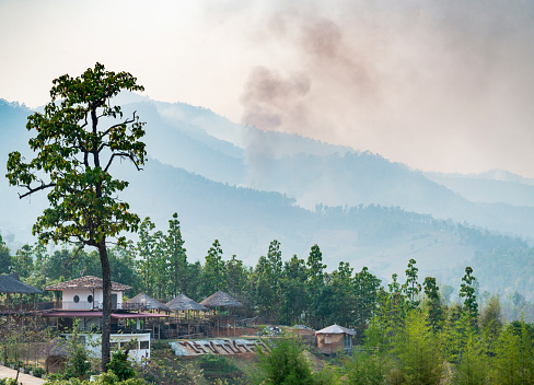 Popular travel destination,dramatic scenery,air hazy and polluted by crop burning fires,in the distant hills, seen from the popular viewing location,just outside the small town of Pai.