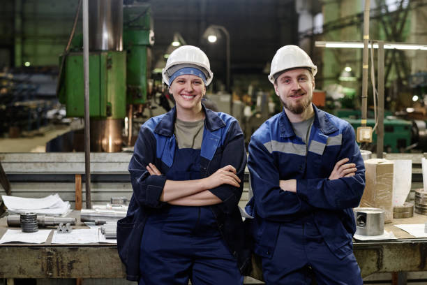 istock Cheerful Man And Woman In Industrial Workshop 2047893878