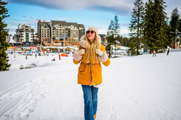 istock Woman walking in the snow covered mountain 2047901416