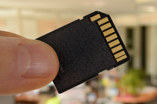 Memory card in hand close-up
