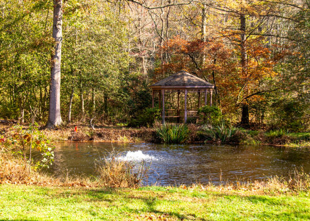 istock Fall gazebo by the pond 2047918003