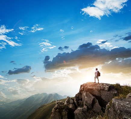 Backpacker on top of the mountain