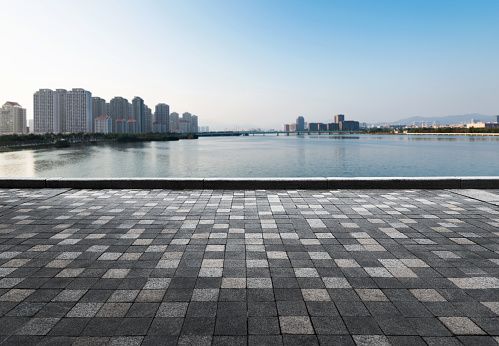 Empty brick road beside the sea