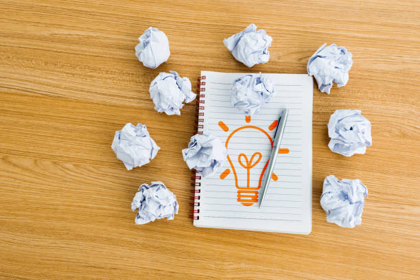 istock Idea light bulb made of crumpled paper ball 2047961914