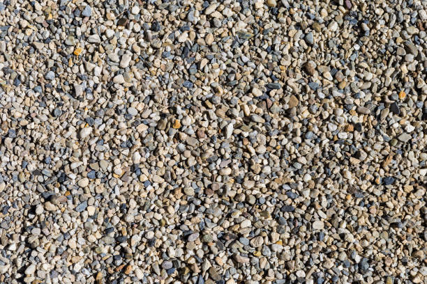 istock Pebble stone background, closeup top view of pebble stones 2047970003