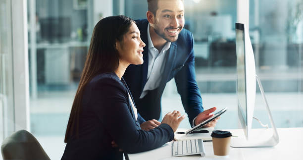 istock Business people, teamwork and planning on computer, tablet and comparison in multimedia research or report. Man and woman with Information technology solution, results or support for digital software 2047992873
