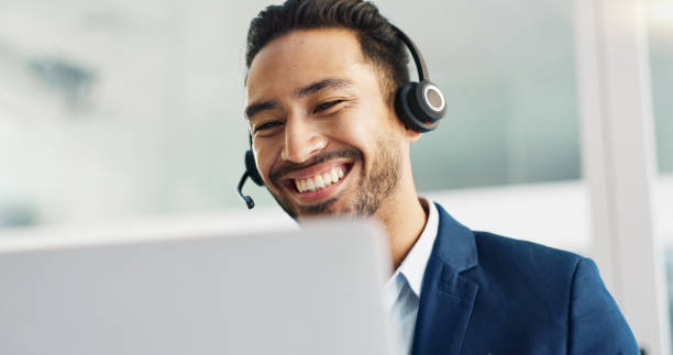 istock Laptop, problem solving and business man in call center with headset for customer support or service. Smile, computer and consulting with happy employee working in tech agency for contact us online 2048000857
