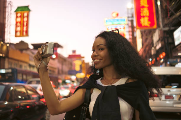 istock Asian woman enjoy travel in  downtown district 2048002500