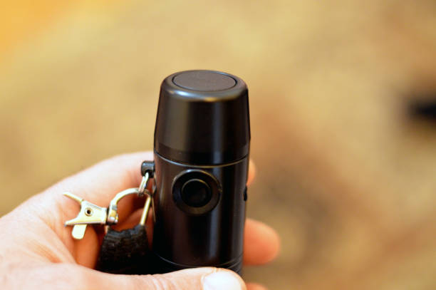 istock Electrolarynx, artificial larynx speech aid, an instrument that allows to express oneself with true voice prosody, used after removal of the larynx by pushing the button and place it on the neck skin 2048016010