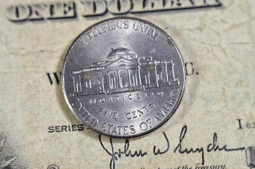 Monticello the primary plantation of Thomas Jefferson the founding father and 3rd president of USA from the reverse side of American money coin of 5 five cents 2016, on old USA  dollar series 1935, selective focus