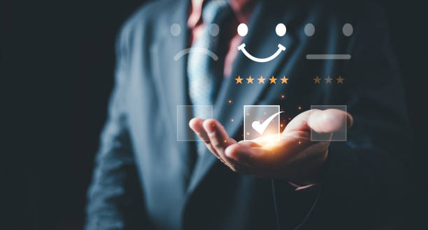 istock Customer service and Satisfaction concept ,Business people are touching the virtual screen on the happy Smiley face icon to give satisfaction in service. rating very impressed. 2048028354