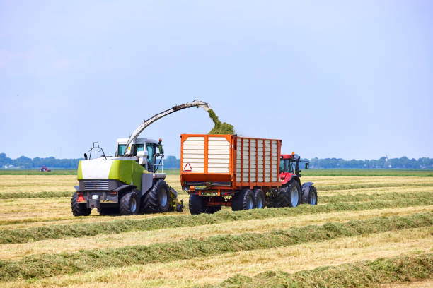 istock Harvest grass with agricultural vehicles 2048034360