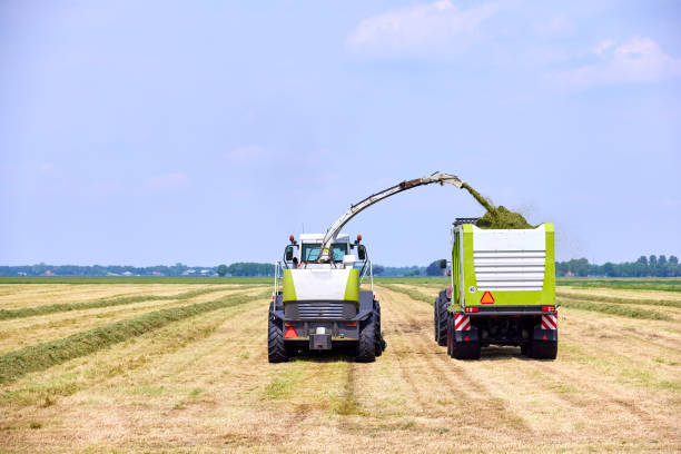 istock Harvest grass with agricultural vehicles 2048035402