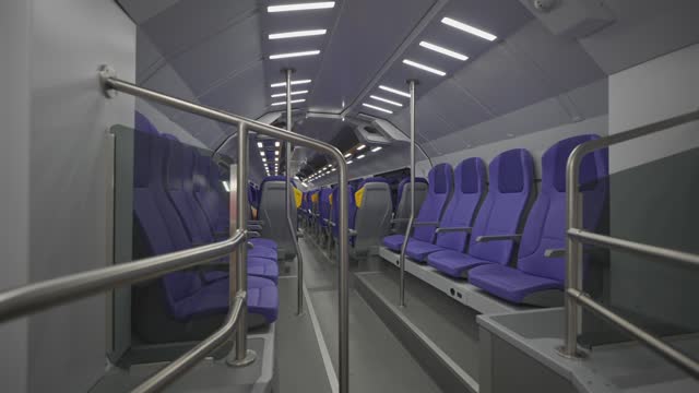 The interior of a modern double-decker Trenitalia Hitachi Caravaggio FNM train in Rome, Italy. Inside view of the new contemporary two-decker electric railway vehicle Hitachi Rail Italy