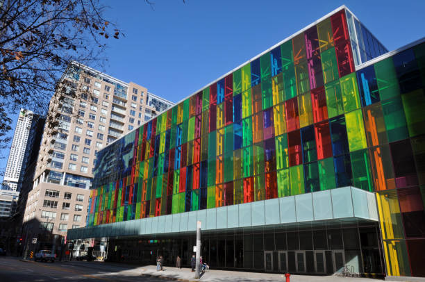 Montreal, QC, Canada, Nov. 8, 2023: Colorful glass panels brighten the facade of the Palais des congrès (convention centre) in Montreal's Quartier international.