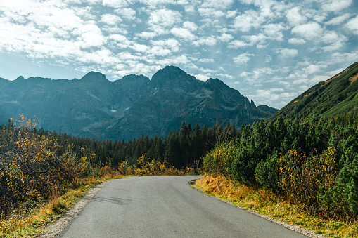country road and green mountains in summer.Tatra National Park in Poland. Famous mountains lake Morskie oko or sea eye lake In High Tatras. Five lakes valley.