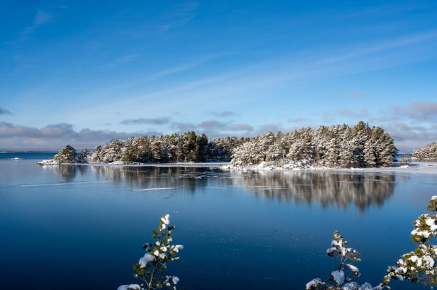 Looking out over islands and clear ice on big lake