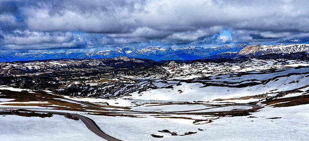 Spectacular view at Beartooth Highway Summit, Wyoming. A Drive of incredible beauty. Yellowstone. Rocky mountains covered by snow. Northwest. Majestic beartooth mountains, alpine landscapes. Road trip.