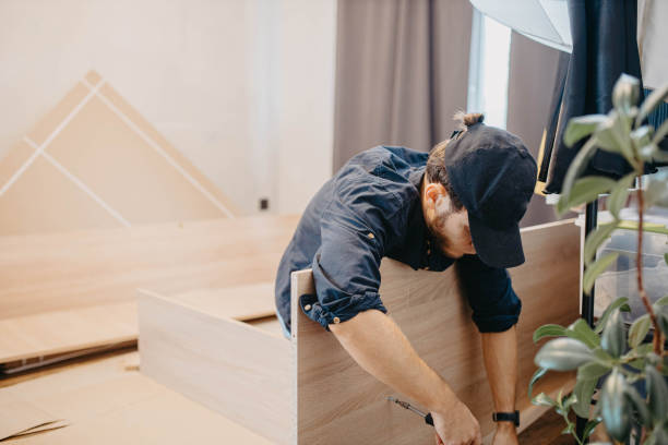 istock man at home using a screwdriver to assemble a new cabinet, assembling furniture 2048097430