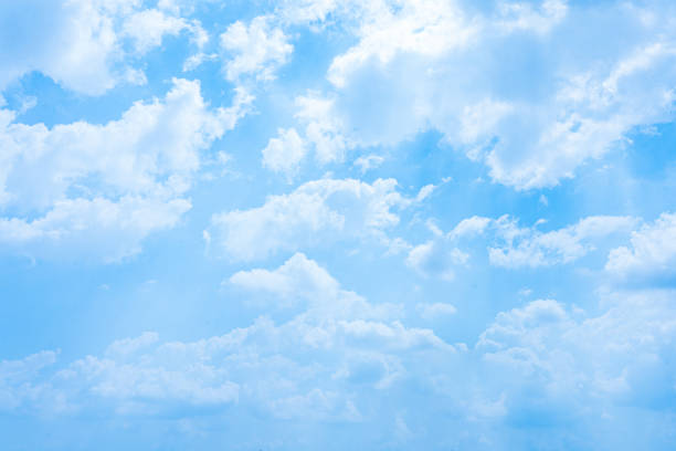 istock Serene Blue Sky adorned with Fluffy White Clouds on a Bright Summer Day, creating a Beautiful Cloudscape in the Clear Atmosphere 2048111924