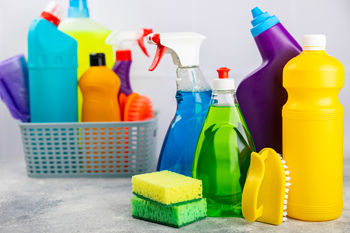 Cleaning service concept.Home cleaning product on a bright background. Bucket with household chemicals. cleaning supplies for home or office space.Early spring regular cleaning. Copy space