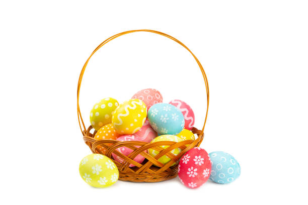 istock Easter basket filled with colorful eggs and a bouquet of tulips on  table. Easter celebration concept. Colorful easter handmade decorated Easter eggs. Place for text. Copy space 2048122114