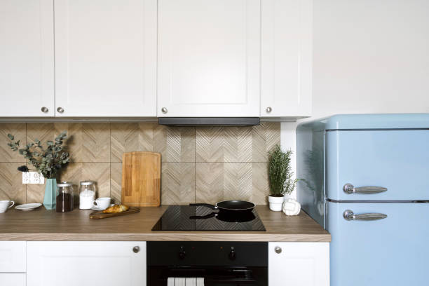 istock Glass ceramic hob with frying pan in kitchen with cozy interior 2048137463