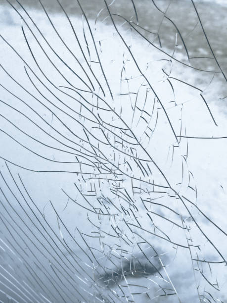 istock Cracks on glass as an abstract background. Texture 2048145917