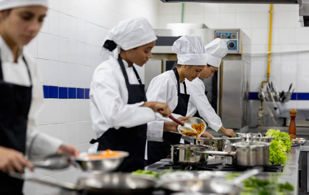 istock Female students preparing food in a cooking class 2048176502