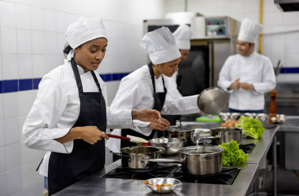 istock Female student preparing food in a cooking class 2048176508