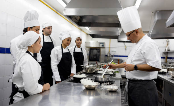 istock Chef teaching a group of students in a cooking class 2048176512