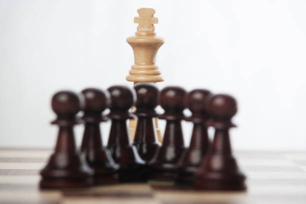 Black pawns versus white king in a chess game