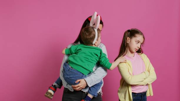 istock Little children having a fight against pink background 2048205871