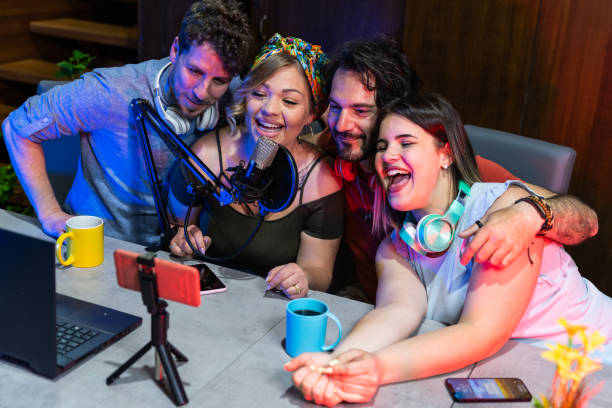 Happy group friends sharing content on streaming platform  smart millennial people having fun vlogging live feeds on social media networks  young people life style wearable tech