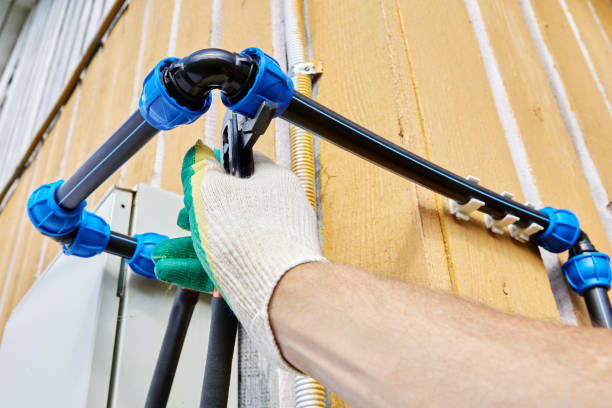 istock Elbow compression fittings for HDPE pipes are used when installing external drinking and irrigation water pipes for cold water, plumber tightens collet nut with pipe wrench pliers. 2048233877