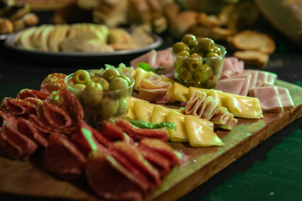 istock Wooden board with chopped cold cuts. Charcuterie. 2048237155