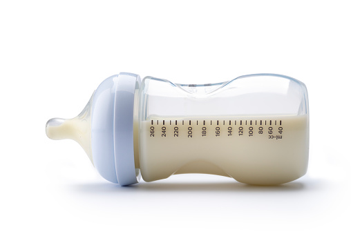 Baby bottler with milk isolated on white background. Studio shot.