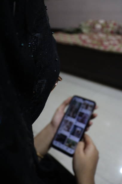 istock A Women Using Mobile Phone & Holding It In Her Hands 2048250323