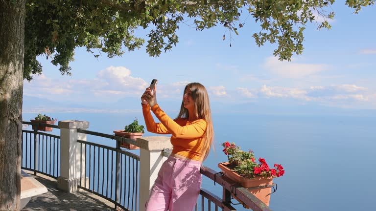 Happy Woman Making Selfie by Smartphone with Scenic View of Sea Coast of Amalfi Coast, Italy