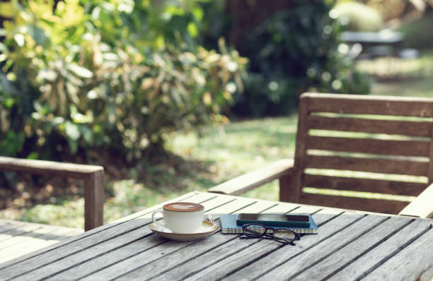 istock coffee drink on old wooden table outdoor 2048296164