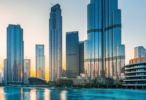 Dubai downtown with modern skyscrapers at sunset. Dubai, United Arab Emirates. Famous travel destination