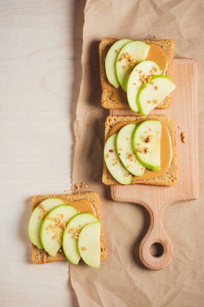 istock Peanut butter toast with apples. 2048318192
