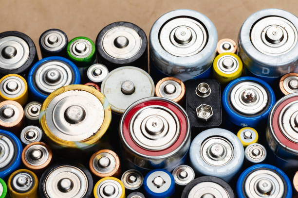 istock Assorted Used Batteries on a Brown Paper 2048323887