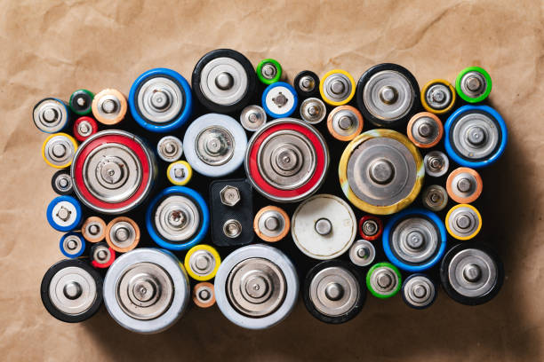 istock Assorted Used Batteries Arranged on a Brown Paper 2048324935