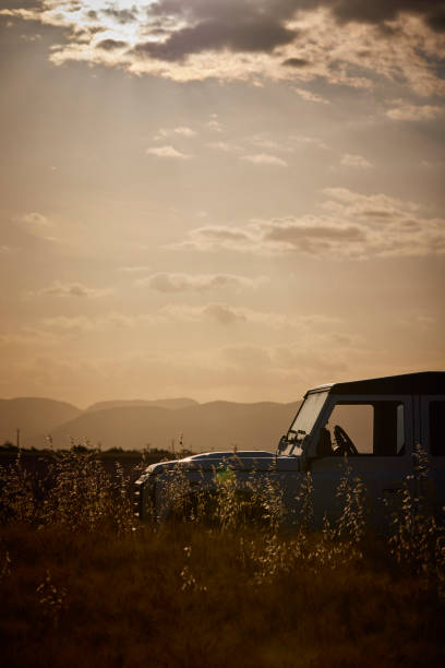 Merzouga, Morocco - September 24, 2019: White off-road car Land Rover Defender in the village street.