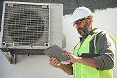 engineer-repairs-air-conditioner.jpg?b=1